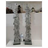 Two Wooden Tree With Lights,  Snow Looking On