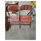 (2) Burnt Orange Metal Folding Chairs