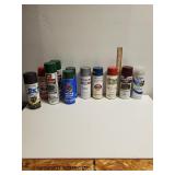 An Assortment Of Spray Paint In Various Brands