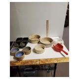 Variety Of Animal Feed Bowls And Red Feed Scoop