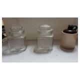 (2) Clear Glass Jars And Jug Shaped Jar
