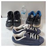 Two Pair Of Nike Sneakers And A Pair Of Jordan