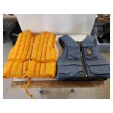Denim Life Vest And Orange Puffy Life Vest