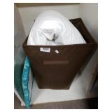 Brown Laundry Basket,  Pillows, Chair Top