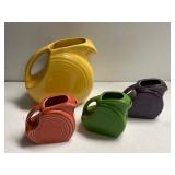 One Medium And Three Small Fiesta Ware Pitchers