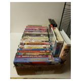 Assortment Of DVD Movies And VHS Tapes