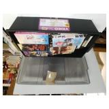 Assorted VHS Tapes In Storage Container