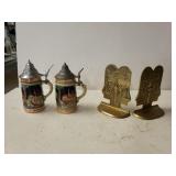 Beer Steins And Bronze Bookends