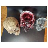 Skulls. Glass ones are votive candle holders(One