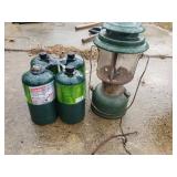 Coleman Propane Tanks And Oil Lamp