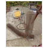 Chicken Wire, Roll Of Wire, And Tomato Plant