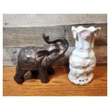 Elephant figures. White one is a vase.