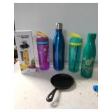 Assorted Water Bottles With Cast Iron Skillet