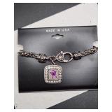 "Inspired" silvertone charm bracelet w/ purple