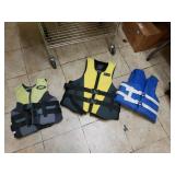 Adult Stearns Life Vest Size Large. And 2 Kids