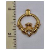 Claddagh goldtone  pendant w/clear crystal stone.