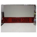 INT. Harvest RD. Metal Road Sign