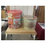 Two Coca-Cola Tins