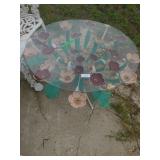 Metal Outdoor Table With Glass Top And Flowers
