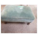 Teal colored upholstered footstool