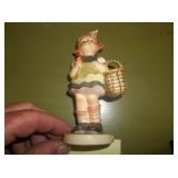 Hummel little girl holding basket