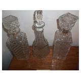 3 clear glass decanters