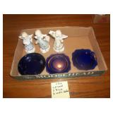 lot of angel figurines and blue glassware