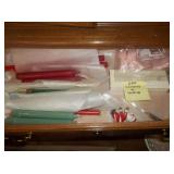 lot of candles and holders