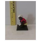 Cast Iron Boy Using Bathroom