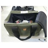 Tote with gun cleaning supplies and locks