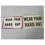 Pair of wear your hard hat signs
