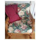 Rattan rocker with pillow