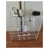 Wire stand, iron, alarm clock and behind the door