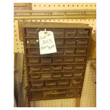 Parts bin. Screwed into walls. Content included.