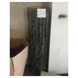 Roll of fence with twigs attached