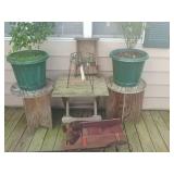 3 tables with two plants and outside decorations