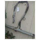 Old farming cattle equipment. Screwed into wood.