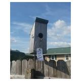 3 wooden bird houses. Attached to fence. Bring