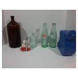 Coke bottle, Rainbow bottle, blue container,and