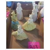 5 lady perfume bottles