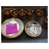 Gold colored cups and plates