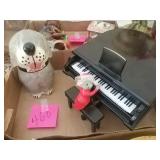 Mouse playing piano with dog treat canister