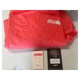 Case poncho, coin and booklet