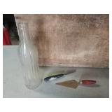 Two letter openers and a bottle