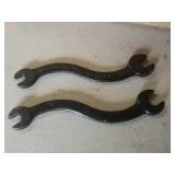 2 curved wrenches