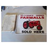 Farmall Sold Here sign