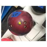 Blue and maroon swirl bowling ball with rack.