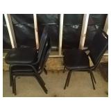 17 black stackable chairs with 2 maroon chairs