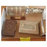 Glass boat in bottle,  with wooden boxes