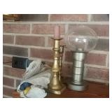 3 candle sticks with candles